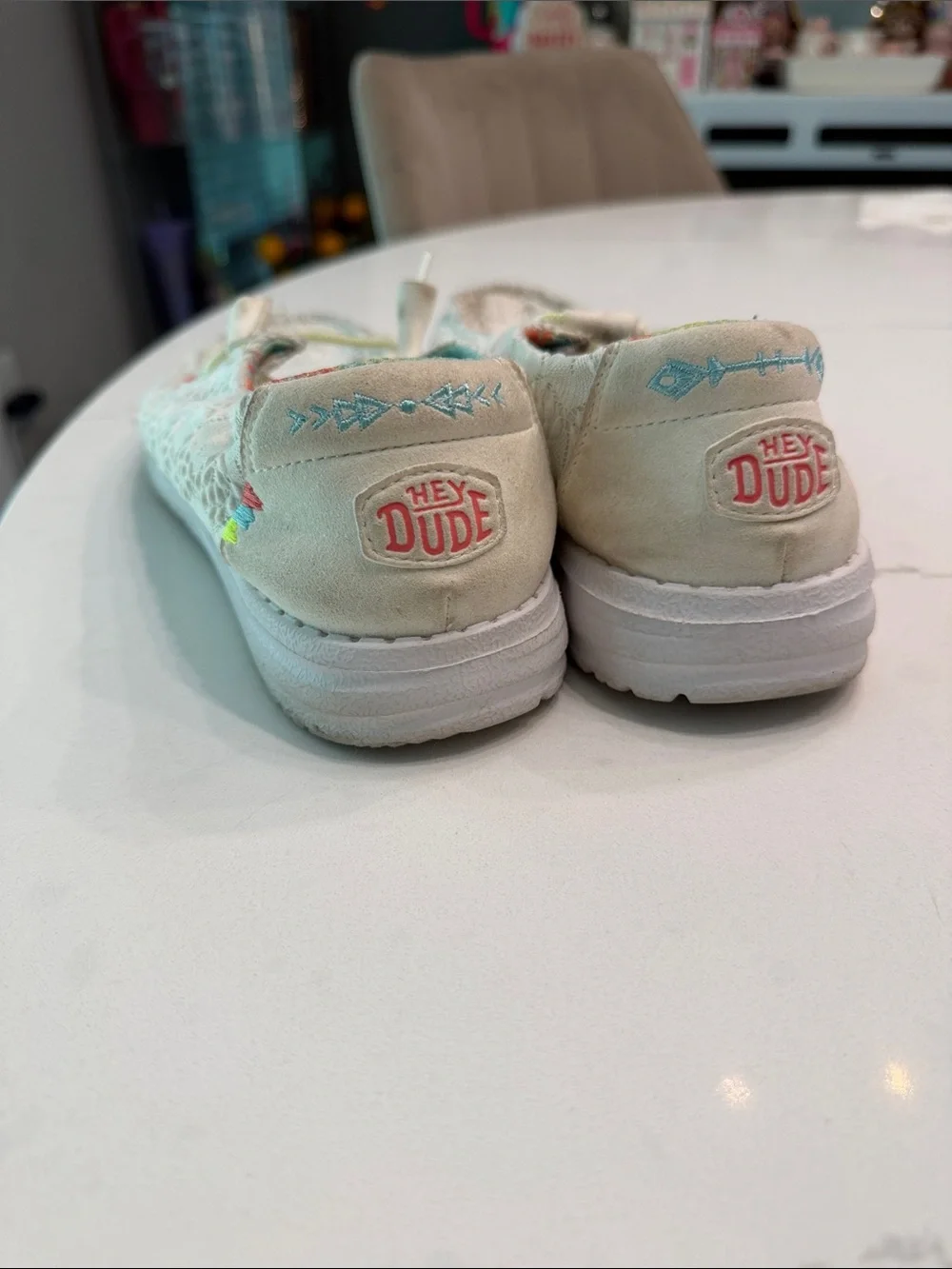 Hey Dude women’s White Slip-On Moccasins with Pastel Rainbow Details